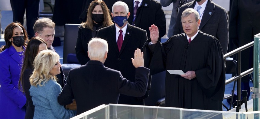 John Roberts, chief justice of the U.S. Supreme Court, center right, administers the oath of office to President-elect Joe Biden on Jan. 20, 2021.