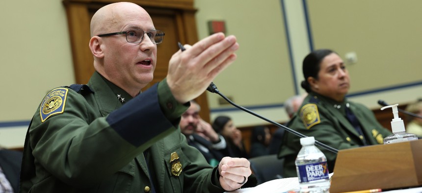 U.S. Customs and Border Protection Agents John Modlin (left), chief patrol agent of the Tucson Sector, and Gloria Chavez, chief patrol agent of the Rio Grande Valley Sector, testify before the House Oversight and Reform Committee on Tuesday. The committee held a hearing to investigate security concerns at the U.S. southern border.