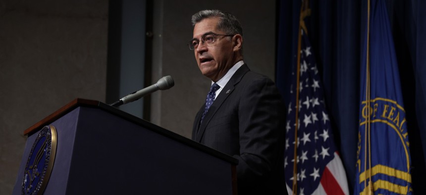 HHS Secretary Xavier Becerra holds a news conference in June. 
