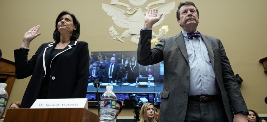 Director of the Centers for Disease Control and Prevention Rochelle Walensky and Commissioner of the Food and Drug Administration Robert Califf are sworn-in during a House Energy and Commerce Subcommittee on Oversight and Investigations and the Subcommittee on Health hearing about the federal response to the coronavirus pandemic on Wednesday. 