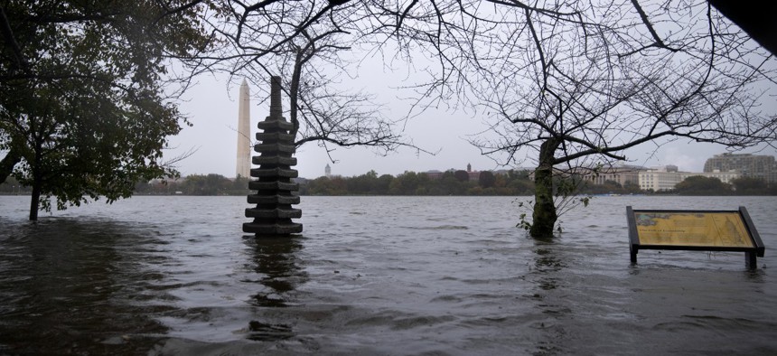 The Japanese Pagoda statue is partially submerged as water rises along the Tidal Basin after heavy rains caused flooding in the Mid-Atlantic region on Oct. 29, 2021 in Washington, D.C. The Biden administration has called for better data and modeling to be able to measure the true cost of climate change to federal property.