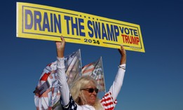 A Trump supporter rallies outside his Mar-a--Lago home on March 21. 