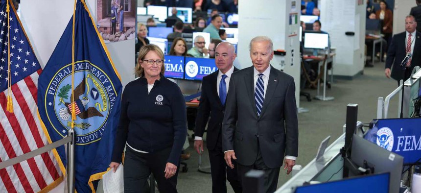 Federal Emergency Management Agency Administrator Deanne Criswell (left), Homeland Security Secretary Alejandro Mayorkas (center) and President Biden during a visit to FEMA headquarters on Sept. 29, 2022.
