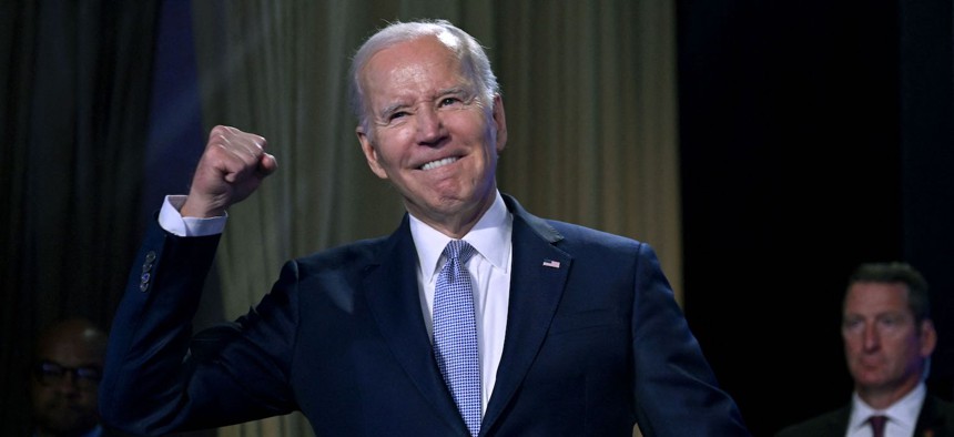 Biden gestures on stage at the Washington Hilton on Tuesday.