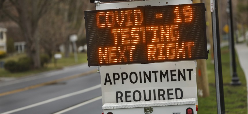 A digital sign directs patients to the drive-thru COVID-19 test site at Stony Brook University on Long Island on March 28, 2020.