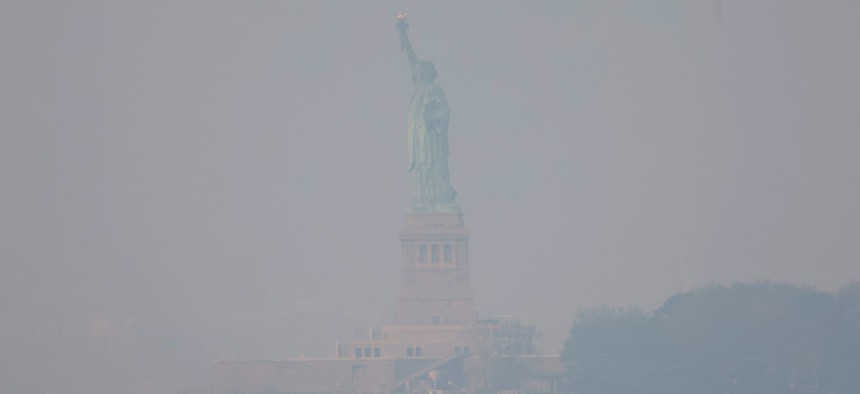 The Statue of Liberty is seen amid hazy conditions due to smoke from the Canadian wildfires on June 08, 2023 in New York City. People in the city and other areas are expected to have another day of bad air Thursday due to smoke from the Canadian wildfires. 