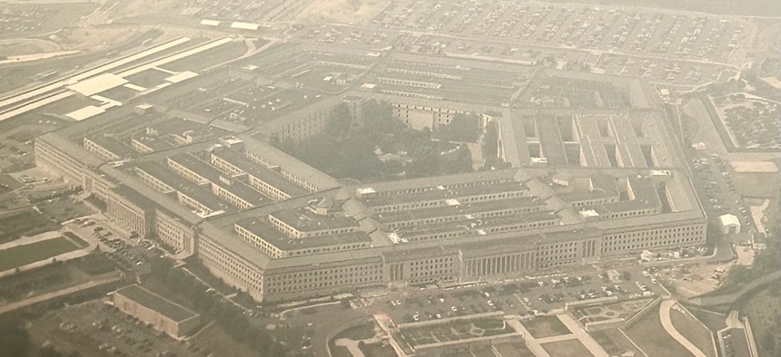 The Pentagon, enveloped in smoke from wildfires in Canada, is seen from the air on June 8, 2023 in Arlington, Va.