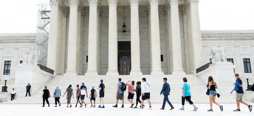 Visitors file into the U.S. Supreme Court building on June 27, 2023. Monday’s dismissal came after a years-long saga that began during the Trump administration.