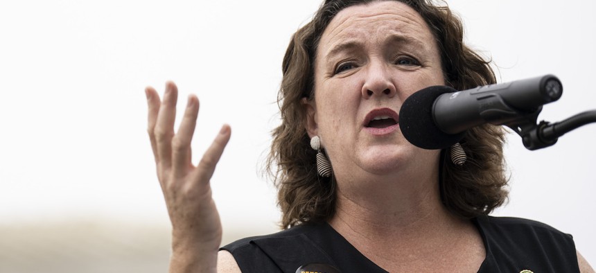 Rep. Katie Porter, D-Calif., speaks during a small rally in front of the Supreme Court on June 22, 2023. Porter said in a statement on Wednesday that the bill would hold acting officials accountable by closing loopholes that allow them to serve without congressional oversight.