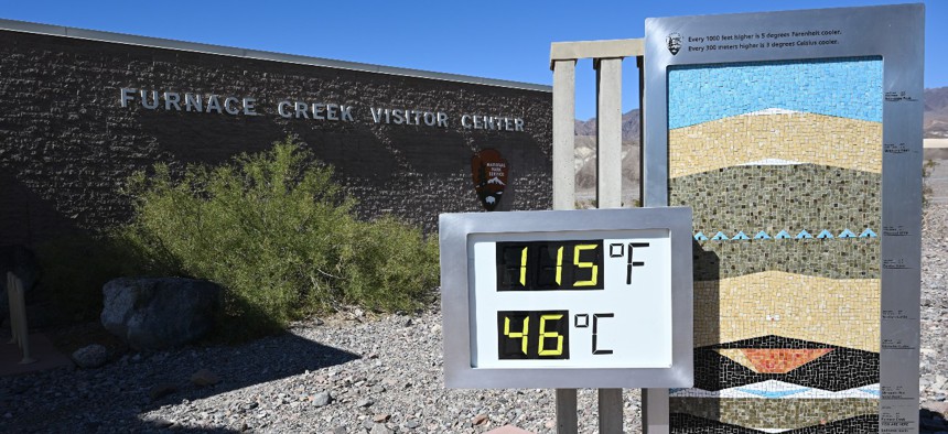 A thermometer shows the heat in Death Valley, California. Long stretches of extreme heat in many areas of the United States this summer have Postal Service employees concerned about safety, especially after a mail carrier in Texas died last month. 