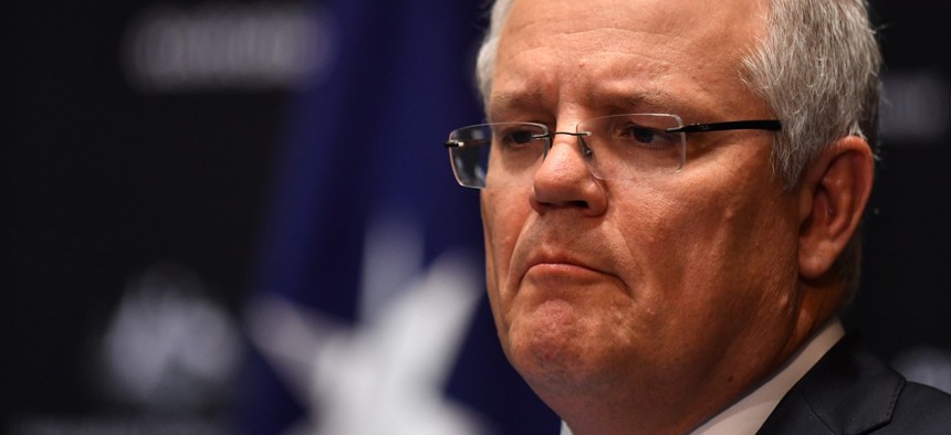Then-Australian Prime Minister Scott Morrison holds a press conference on June 12, 2020. An commission investigation found that the "Robodebt" program to crack down on benefit overpayments overseen by Morrison was unfair and likely illegal. 