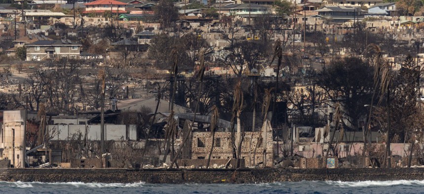 Destroyed buildings and homes are seen from a boat in the aftermath of a wildfire in Lahaina, western Maui, Hawaii on August 12, 2023. 