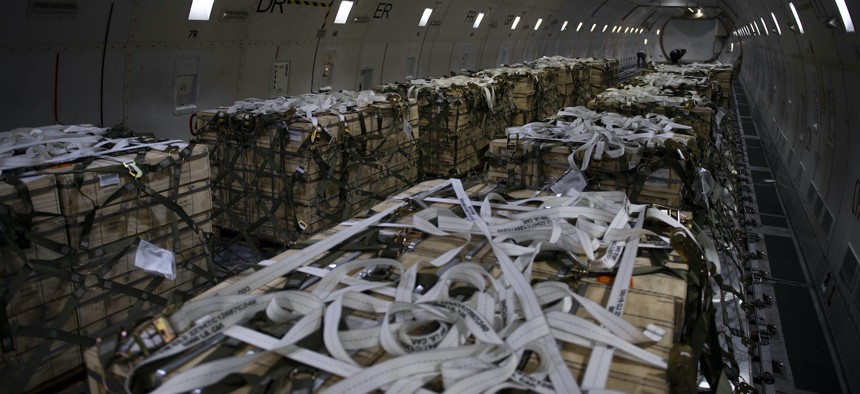 Pallets of ammunition, weapons and other equipment bound for Ukraine are secured onto a plane during a foreign military sales mission at Dover Air Force Base, Delaware, Feb. 28, 2022. 