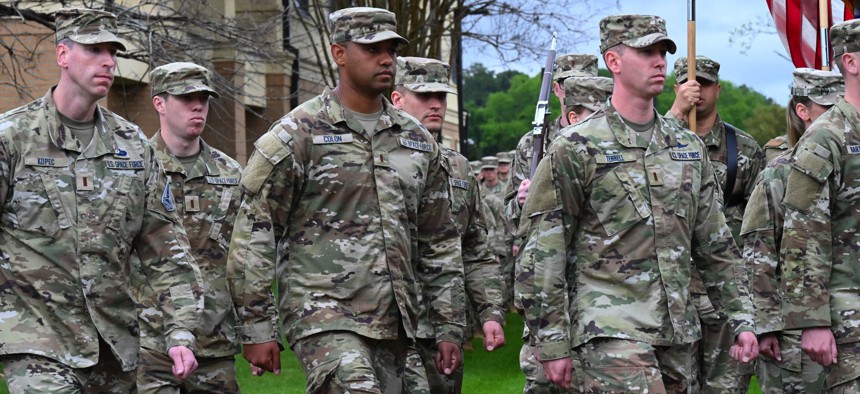 U.S. Space Force Guardians march by for pass and review at Officer Training School, March 10, 2023, at Welch Field, Maxwell Air Force Base, Alabama. 