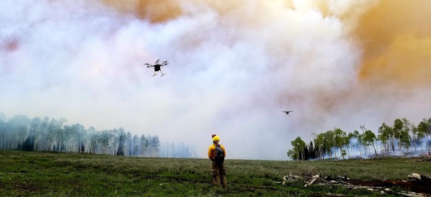 Drone takes off to sample smoke from the Manning Creek stand replacement fire in June 2019.