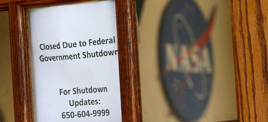 A sign informs the public that the NASA Ames Research Center's visitors registration and pass office is closed due to the government shutdown in Mountain View, Calif., on Jan. 18, 2019. Post-pandemic, many feds continue to telework and with a potential new shutdown on the horizon, some say there isn’t enough clarity around the current rules. 