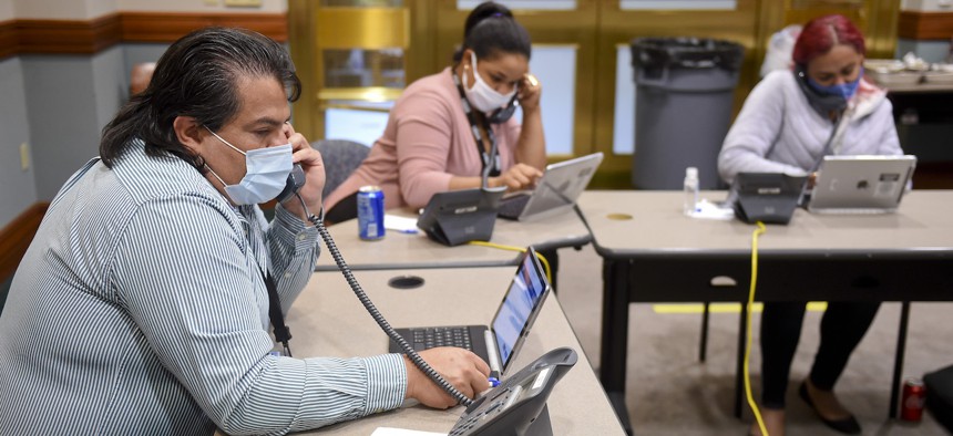 Census workers take calls to collect population data during the 2020 census in Reading, Pa., on Sept. 1, 2020. 