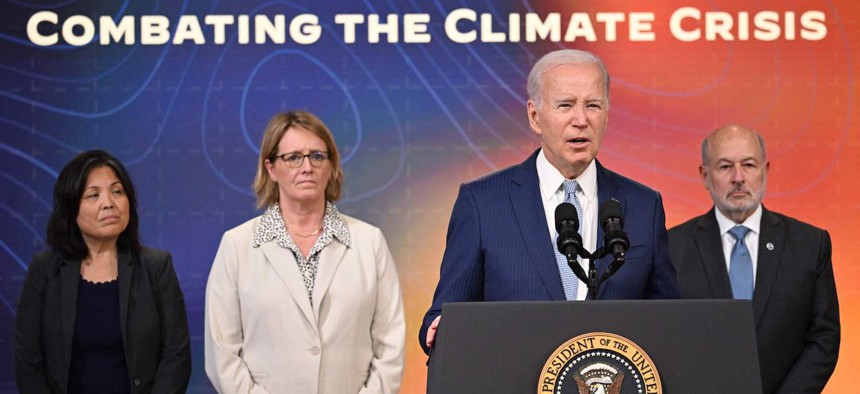 President Joe Biden, joined by acting Labor Secretary Julie Su, FEMA Administrator Deanne Criswell, and National Oceanic and Atmospheric Administration Administrator Rick Spinrad, speaks during a briefing on extreme heat conditions on July 27, 2023.  The American Climate Corps would offer skills-based training to more than 20,000 people in its first year. 