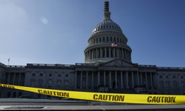 Caution tape blows in the wind on the east front plaza of the U.S. Capitol Building on Sept. 27, 2023. House Speaker Kevin McCarthy, R-Calif., continues to have difficulty finding a legislative path that would prevent the federal government from partially shutting down at midnight on Sept. 30 and would also not jeopardize his speakership. 