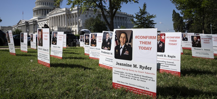 Hundreds of signs representing the growing number of nominations of senior military leaders that have been held up by Sen. Tommy Tuberville, R-Ala., outside the U.S. Capitol on Sept. 19, 2023. VoteVets Action Fund organized the display. Tuberville continues to block hundreds of military nominations and promotions until the Pentagon cancels a policy ensuring that service members have access to abortion. 
