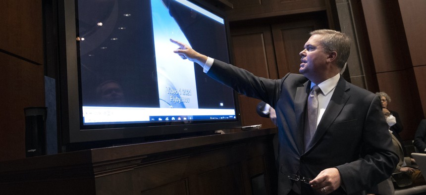 In this 2022 photo, U.S. Deputy Director of Naval Intelligence Scott Bray explains a video of an unidentified aerial phenomena, as he testifies before a House Intelligence Committee subcommittee hearing. 