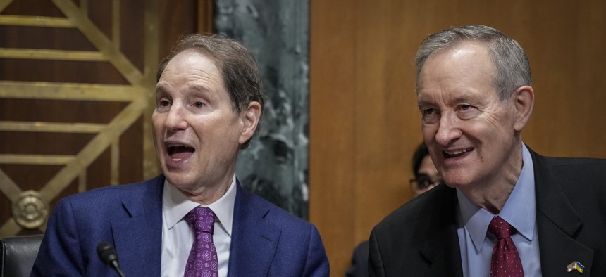 Sens. Ron Wyden, D-Ore., (L) and Mike Crapo, R-Ida. lead a Finance Committee hearing in March 2022.