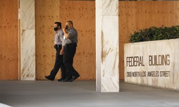 Security officers outside field offices of the U.S. Citizenship and Immigration Services in Los Angeles on July 27, 2020.