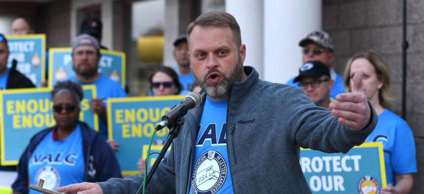Brian Renfroe, president of the National Association of Letter Carriers, leads a rally in Aurora, Colo., on Oct. 24, 2023. 
