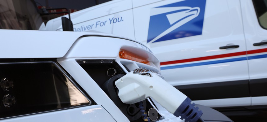 USPS officials said Tuesday they plan to cut the service's greenhouse gas emissions by 40% by 2030.