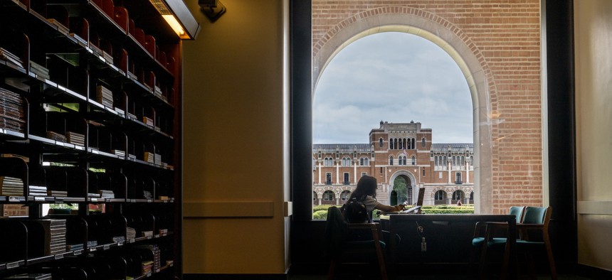 A student studying in the Rice University Library, in Houston, Texas. 