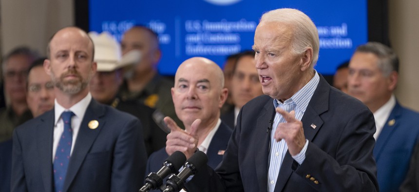 President Joe Biden speaks on immigration and border security at the Brownsville Station on February 29, 2024 in Olmito, Texas alongside DHS Secretary Alejandro Mayorkas (to Biden's right) and other officials.