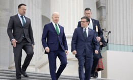 President Biden (second from the left) and House Speaker Mike Johnson, R-La.,  (third from left) walk down the east steps of the Capitol on March 15, 2023. Biden has thrown his support behind the new funding deal appropriators have worked out. 