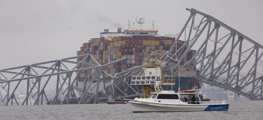 Workers continue to investigate and search for victims after the cargo ship Dali collided with the Francis Scott Key Bridge in Baltimore causing it to collapse on March 27, 2024. Two survivors were pulled from the Patapsco River and six missing people are presumed dead after the Coast Guard called off rescue efforts. 