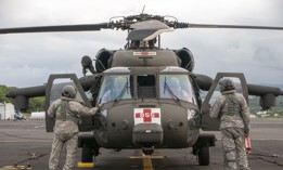 Soldiers from the Hawaii Army National Guard preparing an HH-60 Black Hawk utility helicopter for flight as part of rescue operations in 2018.