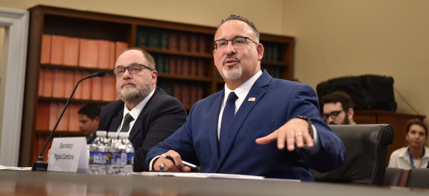 Education Secretary Miguel Cardona, right, said Thursday that the department would soon implement new regulations governing how U.S. colleges and universities respond to sexual misconduct allegations. 