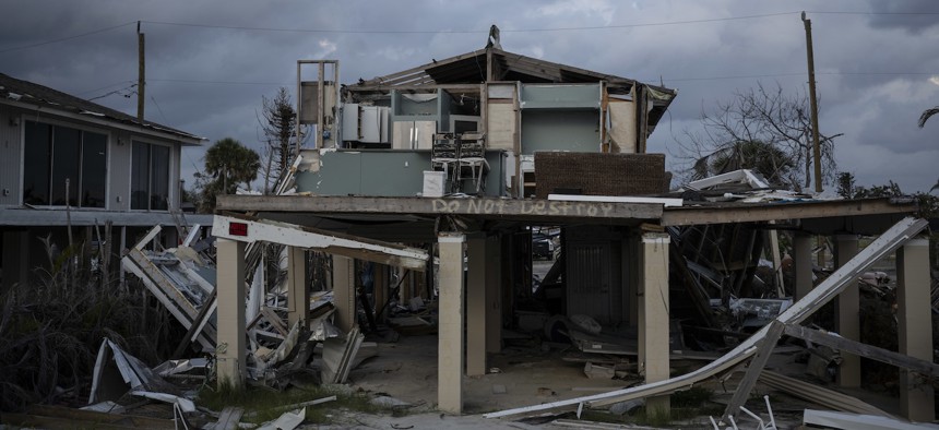 A home damaged in Fort Myers Beach, Fla. shown here on June 20, 2023, almost nine months after Hurricane Ian ravaged the area.
