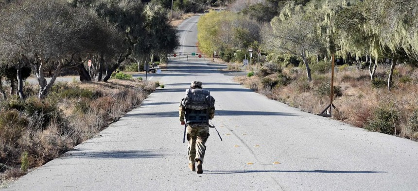 A soldier participates in the Norwegian Foot March at Fort Ord National Monument, in Monterey County, California, Oct. 28, 2022. Mounting evidence shows that to kill pervasive poison oak and other weeds at Fort Ord — a former Army base, which closed in 1994 — the military sprayed and experimented with the powerful herbicide combination Agent Orange as far back as the 1950s.