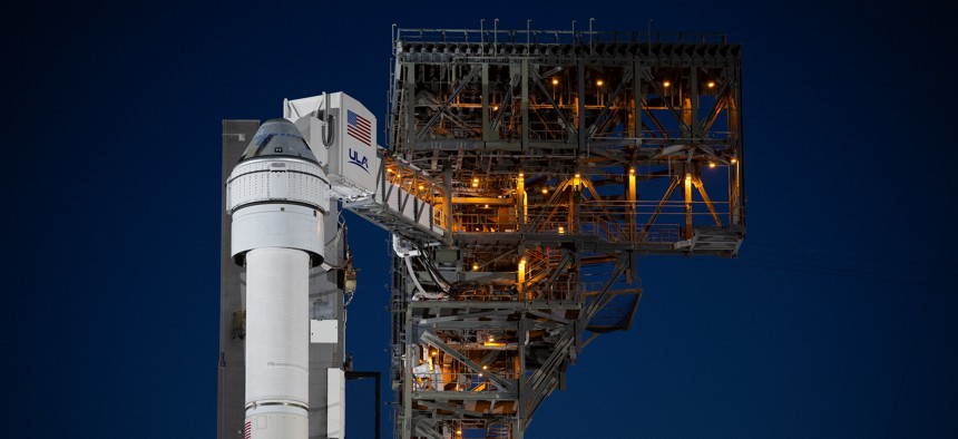 A United Launch Alliance Atlas V rocket with Boeing’s CST-100 Starliner spacecraft aboard is seen illuminated by spotlights on the launch pad at Space Launch Complex 41 ahead of the NASA’s Boeing Crew Flight Test.