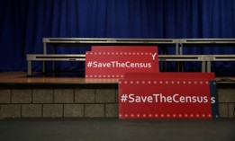 Signs sit behind the podium before the start of an April 3, 2018 press conference with New York Attorney General Eric Schneiderman to announce a multi-state lawsuit to block the Trump administration from adding a question about citizenship to the 2020 Census form. Critics of President Donald Trump's administration's decision to reinstate the citizenship question contended that it would frighten people in immigrant communities from responding to the census. The Trump administration stated a citizenship question on the census will help enforce voting rights. 