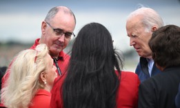 President Joe Biden is welcomed by United Auto Workers President, Shawn Fain, second from left, and Rep. Debbie Dingell, D-Mich., left, on arrival at Detroit Metropolitan Wayne County Airport in Romulus, Michigan, on Sept. 26, 2023. 