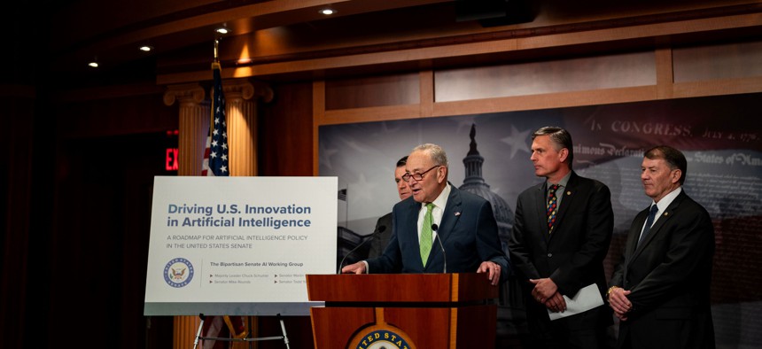  Senate Majority Leader Chuck Schumer, D-N.Y., flanked by Sen. Todd Young, R-Ind., Sen. Martin Heinrich, D-N.M., and Sen. Mike Rounds, R-S.D., speaks during a news conference at the U.S. Capitol on May 15, 2024 in Washington, DC. A bipartisan Senate working group focused on artificial intelligence released a policy roadmap, which encourages the executive branch and appropriators to support $32 billion in annual innovation funding.