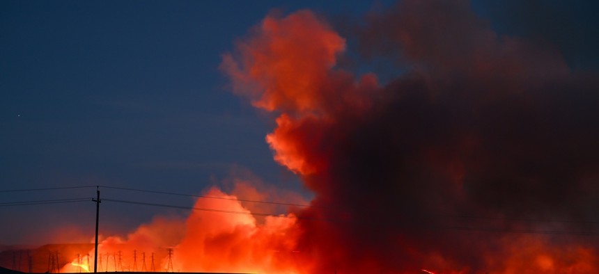 A view of transmission towers in flames as Corral Fire continues in San Joaquin County, Calif., on June 2.