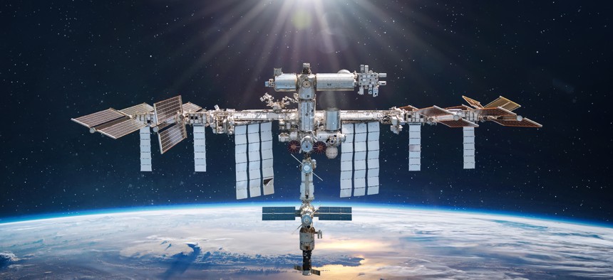 International space station in 2022 in outer space. Satellites like the ISS could be attack vectors for hackers. 