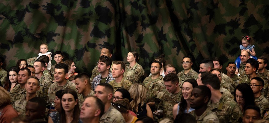 Military personnel and their families wait for President Biden to speak at Fort Liberty, N.C. in June 2023. In 2022, only 26% of active-duty military voted compared to 46.2% of the general population. 