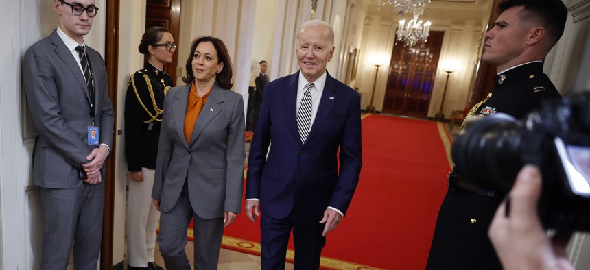 Vice President Kamala Harris and President Joe Biden arrive for the signing of the executive order on AI on October 30, 2023. 