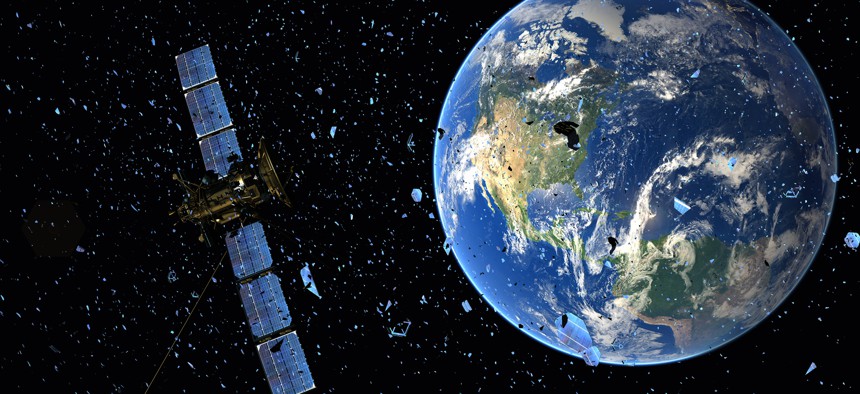 Satellite in orbit among space debris-3d illustration.