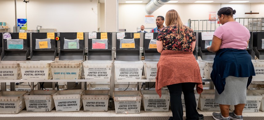 Service Center employees sort and process mail at an IRS processing facility on Sept. 6 in Austin, Texas. IRS' workforce generally became more diverse between fiscal years 2013 and 2022.