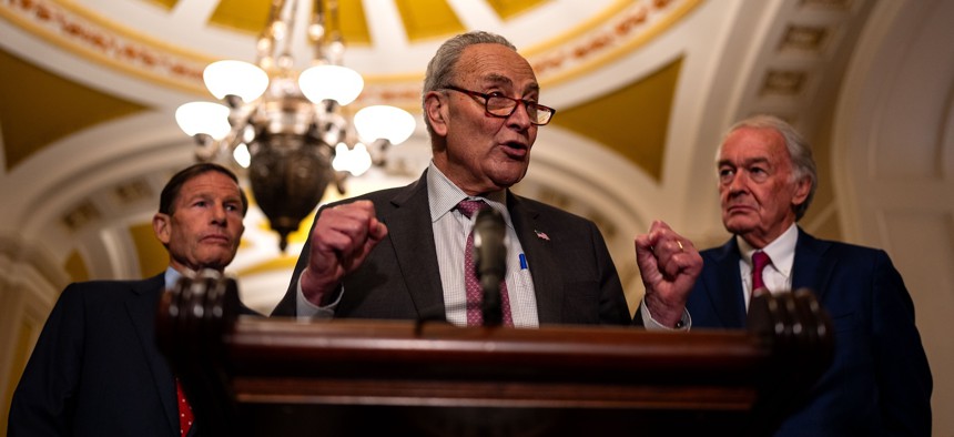 Senate Majority Leader Chuck Schumer, D-N.Y., speaks to reporters alongside Sens. Richard Blumenthal, D-Conn., and Ed Markey, D-Mass.,. Schumer and Markey are asking OMB to do more to mitigate AI bias at federal agencies. 