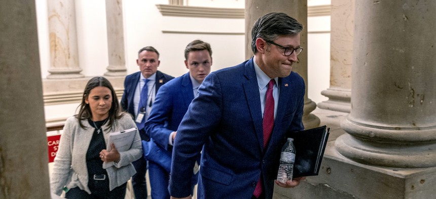 House Speaker Mike Johnson, R-La., heads to his office before the vote on the government funding bill at the U.S. Capitol on Sept. 18, 2024. 