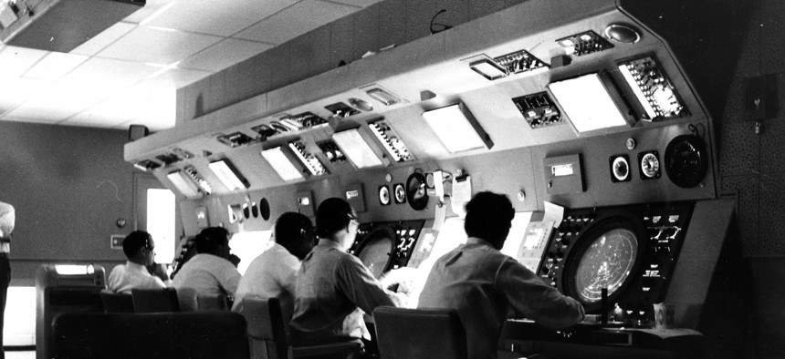 Air traffic controllers at work in the control tower of Boston's Logan Airport in 1968. A new oversight report found that US aviation systems are plagued by legacy equipment and are in need of upgrades.